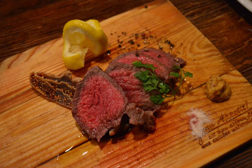 La Tepparnya Warm welcome: Rump of beef steak served with Dijon mustard and dried fig at La Tepparnya, a friendly restaurant in Osaka's Juso neighborhood. | JJ O'DONOGHUE