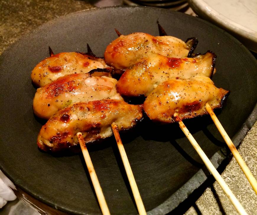 Fuku Flamed to perfection: Grilled oysters at Fuku. | ROBBIE SWINNERTON