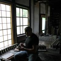Historic hand-me-down: Euan Craig creates pottery using the wooden kick wheel given to him by the grandson of the late, great potter Shoji Hamada, who was designated a living national treasure. Early joys, trials put potter on path to the simple life
