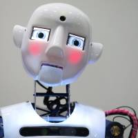 Face of the future: A RoboThespian humanoid robot developed by Engineered Arts Ltd. interacts with visitors at the 2013 International Robot Exhibition in Tokyo. Though technology has a long way to go before it can emulate human cognition, a study by the University of Oxford in Britain has revealed that there are many jobs that will likely be done by robots and computers in the near future. Automation set to affect our job prospects