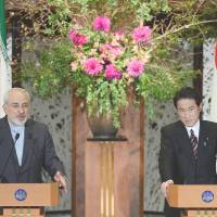Iranian Foreign Minister Mohammad Javad Zarif fields a question during a news conference with Foreign Minister Fumio Kishida following their talks in Tokyo on Wednesday. Kishida prods Tehran counterpart on Iran nuclear program
