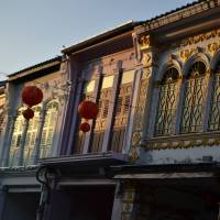 Faded glory: The sun sets on Peranakan buildings on Thalang Road in Phuket. These 19th-century buildings were built in a “Sino-Portuguese” style. Phuket puts Peranakan heritage back on map
