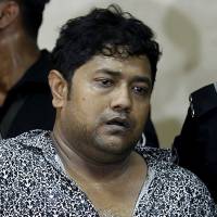 Bangladeshi property tycoon Sohel Rana is presented at a press conference last April 28 at the Rapid Action Battalion headquarters in Dhaka. The owner of a nine-storey building that collapsed and killed 1,135 Bangladeshi garment workers that month is to face murder charges, police said Tuesday. Owner of collapsed Bangladesh factory faces murder charges