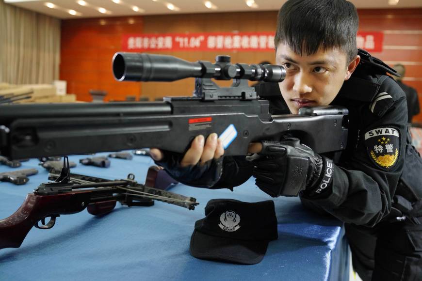 Chinese police begin carrying guns on patrols The Japan Times