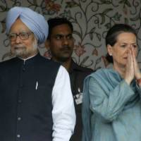 Indian Prime Minister Manmohan Singh and Congress party chief Sonia Gandhi attend a foundation stone laying ceremony for a hydro power project in Jammu on June 25 last year. A tell-all book by a former aide to Singh that depicts him as a powerless puppet hit bookstores on Saturday. India Premier Singh a puppet in office and 'not in power,' book by top aide claims