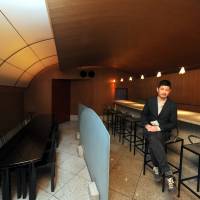 Takeout: Aric Chen, curator for design and architecture at M+ in Hong Kong, sits inside the Kiyotomo sushi bar designed by Shiro Kuramata. The former restaurant will be dismantled and rebuilt as an exhibit at the Hong Kong museum. Shiro Kuramata's iconic sushi bar heads to Hong Kong museum