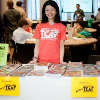 Flipping through: A volunteer staffs an area for children at last year’s Toronto Comic Arts Festival. Manga becomes a major draw at Toronto Comic Arts Festival