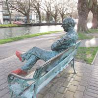 Silence is golden: A bronze depiction of acclaimed poet Patrick Kavanagh sits by the Grand Canal in Dublin in March. Dublin visit 'like stepping back into a novel'