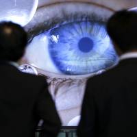 Visitors examine the detail in a Sony Corp. 4K Bravia LCD television screen at the company’s headquarters in Tokyo last week. Sony breakup 'long overdue,' analysts say