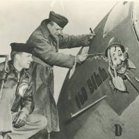 U.S. Army Air Forces Capt. William D. Whitson (left) watches as Bruce Bairnsfather, official cartoonist to the American forces in Europe, adds the finishing touches to a painting of his World War I character “Old Bill” to a B-17 Flying Fortress bomber of the same name in April 1943. As D-Day's 70th anniversary nears, race is on to save WWII artwork