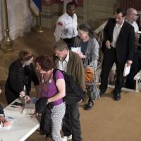 Glenn Greenwald signs copies of his book at the Sixth & I Synagogue on Wednesday in Washington. Greenwald spoke about his new book No Place to Hide and about working with Edward Snowden, who leaked documents about United States surveillance and intelligence programs. Greenwald claims his book reveals 'true picture' of Snowden