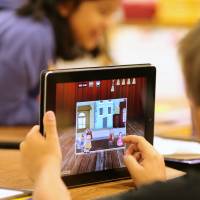 Hooked on apps: A child uses an iPad as part of a classroom activity. Parents who worry their children spend too much time looking at screens are looking to apps to limit their kids’ use of mobile devices. Apps help parents control kids' mobile devices