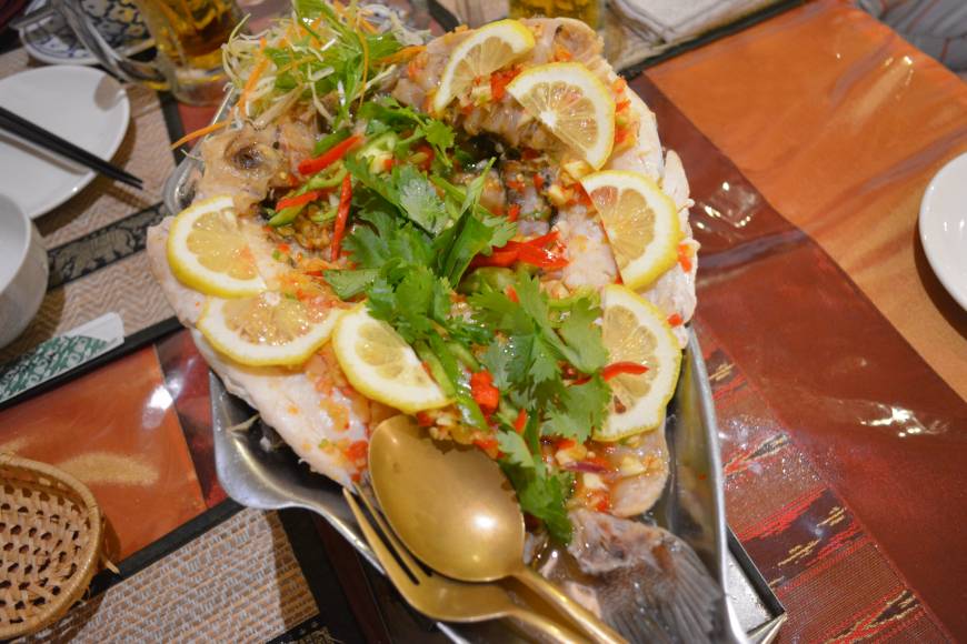 Baan Suki Showpiece: 'Pla neung manao,' a dish of steamed sea bream with lemon and an array of spices, makes an impressive finale to dinner at Baan Suki. | J.J. O'DONOGHUE