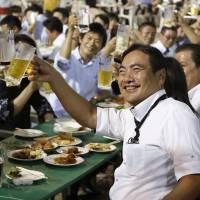Here’s to happiness: Office drinking parties might be one way to stave off boredom with your job. Japan's salarymen are bored to tears