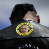 A Gulf War veteran wears a sticker in support of U.S. Army Sgt. Bowe Bergdahl at the “Bring Bowe Back” rally in Hailey, Idaho, in June 2013. Bergdahl link to U.S. deaths 'flimsy'