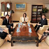 Panelists and a moderator (center) pose before their discussion on Japanese female science majors and their career at The Japan Times’ office building in Tokyo on June 17. Examining women's roles in Japan's corporate structure