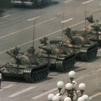 The Chinese man who eventually went on to be known as “Tank Man,” blocks a line of tanks heading east on Beijing’s Changan Avenue from Tiananmen Square in Beijing in this iconic photo taken on June 5, 1989. Tiananmen: The story as it was written 25 years ago