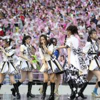 Members of AKB48 perform during the all-girl pop idol group’s annual popularity poll extravaganza in Tokyo on Saturday, a month after two members were attacked by a saw-wielding assailant. Mayu Watanabe was voted the top AKB48 idol and will lead the group for the next year. AKB48 rebounds from saw assault to crown new queen bee