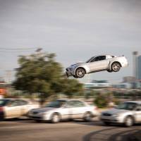 Authentic mayhem: Director Scott Waugh chose to avoid CGI for the car chases (and crashes) in “Need for Speed.” © 2014 DreamWorks llC. Distribution Co. The pleasures of driving like an absolute maniac