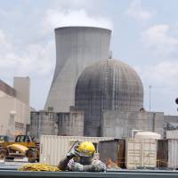 Men assemble a new reactor at the Vogtle nuclear plant in Waynesboro, Georgia, on June 13. Problems dog plans for U.S. nuclear plants