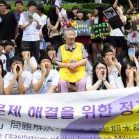 South Koreans gather Wednesday in front of the Japanese Embassy in Seoul during a meeting of top diplomats from the two countries. to protest Tokyo’s position on the sexual slavery engaged in before and during World War II. Tokyo rejects U.N. call to take blame for 'comfort women'