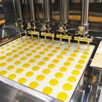 Gourmet gadgets: A Heishin pump used for precisely filling containers. The FOOMA expo drew nearly 100,000 attendees with automated kitchen equipment. Expo shows industrial-kitchen tech to fuel any foodie’s product lust