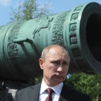 Russian President Vladimir Putin waits outside the Kremlin to present state awards to public figures on Thursday. Putin may be past point of no return in Ukraine