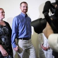 Dr. Kevin Brantly, who contracted the deadly Ebola virus, and wife, Amber, arrive at a Thursday press conference at Emory University Hospital in Atlanta. Brantly a second American aid worker who contracted Ebola treating victims of the deadly virus in Liberia have recovered and were discharged by the Atlanta hospital that treated them with an experimental drug. Two American Ebola patients released from Atlanta hospital