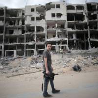 Italian Associated Press video journalist Simone Camilli, 35, is seen Monday in Beit Lahia in the Gaza Strip. He was among at least five people killed in northern Gaza on Wednesday as sappers were dismantling an Israeli missile. Noted AP video journalist Simone Camilli killed in Gaza