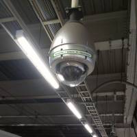 Eye in the sky: A security camera watches over a train platform in Minato Ward, Tokyo. Tokyo's robotic eyes are everywhere