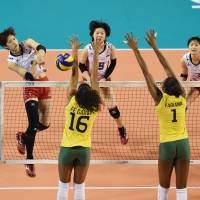 Wing commander: Miyu Nagaoka (left) spikes the ball during Japan's loss to Brazil in the FIVB World Grand Prix Finals at Ariake Colosseum on Sunday. Brazil denies Japan World Grand Prix title
