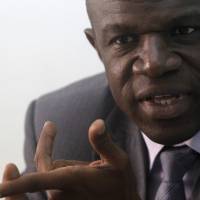 Dr. Daouda Coulibaly, head of epidemiological monitoring service of the National Institute for Public Health of Côte d’Ivoire (INHP) in charge of Ebola, speaks during an interview in Abidjan last week. The country is taking the kind of aggressive anti-infection measures that its poorer, smaller western neighbors were slow to adopt. Hand-washing stations have appeared at the entrances of government buildings and office towers in Abidjan, the bustling economic capital. People have abandoned the traditional three-kiss greeting. West African powerhouse Cote d'Ivoire battles to keep out Ebola