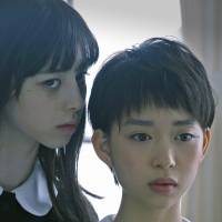 Sweet, terrifying nothings: A ghostly Aya (Ayami Nakajo) whispers in the ear of Michi (Aoi Morikawa) in Mari Asato’s new horror “Gekijoban Rei: Zero (Fatal Frame).” Fatal Frame: Mari Asato's uncanny, ghostly dopplegangers