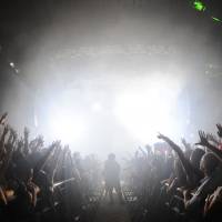 Here comes the drop: A photographer grabs a picture while the crowd cheers around him at Sonicmania in Tokyo in August. Remaking the EDM experience for Japan