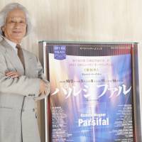 Set the stage: Maestro Taijiro Iimori stands next to a poster for the “Parsifal” production he will conduct at the New National Theatre, Tokyo. Iimori is widely considered an expert in conducting the works of Richard Wagner. Maestro Taijiro Iimori will mark his NNTT debut with Wagner's 'Parsifal'