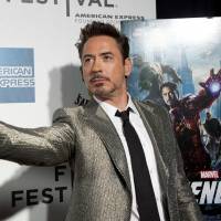 Heroes of film: Actor Robert Downey Jr. poses as he arrives at the screening of the film Marvel's The Avengers at the Tribeca Film Festival in New York in April 2012. Marvel unveils huge slate of new superhero films