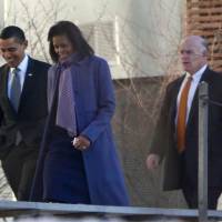 U.S. President Barack Obama and first lady Michelle Obama are followed by U.S. Secret Service agent Joseph Clancy on the snow-covered grounds of the Sidwell Friends school in Bethesda, Maryland, in this January 29, 2009 file photo. U.S. Secret Service Director Julia Pierson resigned under fire on Wednesday and Clancy has been named acting director. Secret Service chief resigns over security breaches