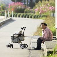 An elderly woman sits on a step in the village of Kawauchi, Fukushima Prefecture, on Tuesday. The government lifted its evacuation advisory for the eastern part of the village on Wednesday. The community is the second to see the advisory lifted in the former no-gone zone, following the March 2011 meltdowns at the Fukushima No. 1 nuclear plant. Evacuation advisory lifted for part of Fukushima village of Kawauchi