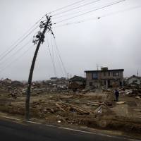 A neighborhood in Watari, Miyagi Prefecture, lies in ruins on April 22, 2011, following the Great East Japan Earthquake and tsunami. Prosecutors set to decide whether to indict Tepco execs over nuclear disaster