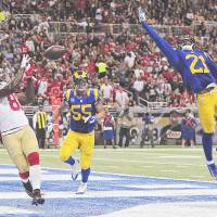 Good hands: San Francisco's Anquan Boldin catches a touchdown pass against St. Louis in the second half on Monday. 49ers step up, rally by Rams