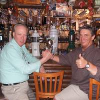 Prost!: Bernd Haag (right) greets a customer at his bar in Tokyo. Bernd Haag: 'Learn a new language and start to think global'