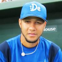 Keeping positive: Yokohama BayStars infielder Yulieski Gourriel gives a “thumbs-up” sign prior to a late-season game against the Yomiuri Giants at Tokyo Dome, despite the uncertainty of his future — and that of his countrymen — in Japan. Cuban players experienced mixed success this season