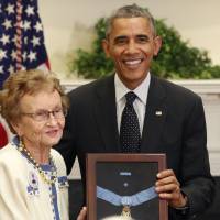 Helen Loring Ensign, 85, of Palm Desert, California, on Thursday at the White House receives the Medal of Honor from U.S. President Barack Obama on behalf of Army First Lt. Alonzo Cushing, for conspicuous gallantry. Cushing was awarded for his actions while serving as commanding officer of Battery A, 4th United States Artillery, Artillery Brigade, 2nd Corps, Army of the Potomac during combat operations in the vicinity of Cemetery Ridge, Gettysburg, Pennsylvania, on July 3, 1863. Civil War officer receives Medal of Honor