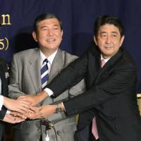 Liberal Democratic Party executives running for the party's September 2012 presidential race join hands during a debate at the Foreign Correspondents' Club of Japan in Tokyo. LDP stiff-arms foreign journalists for election