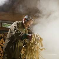 An artisan prepares Honminoshi, a type of “washi” made in Gifu Prefecture. The process begins with the boiling of pulp from a mulberry tree. UNESCO added the venerable handmade paper to its Intangible Cultural Heritage list on Wednesday. Government, paper makers welcome addition of 'washi' to UNESCO list