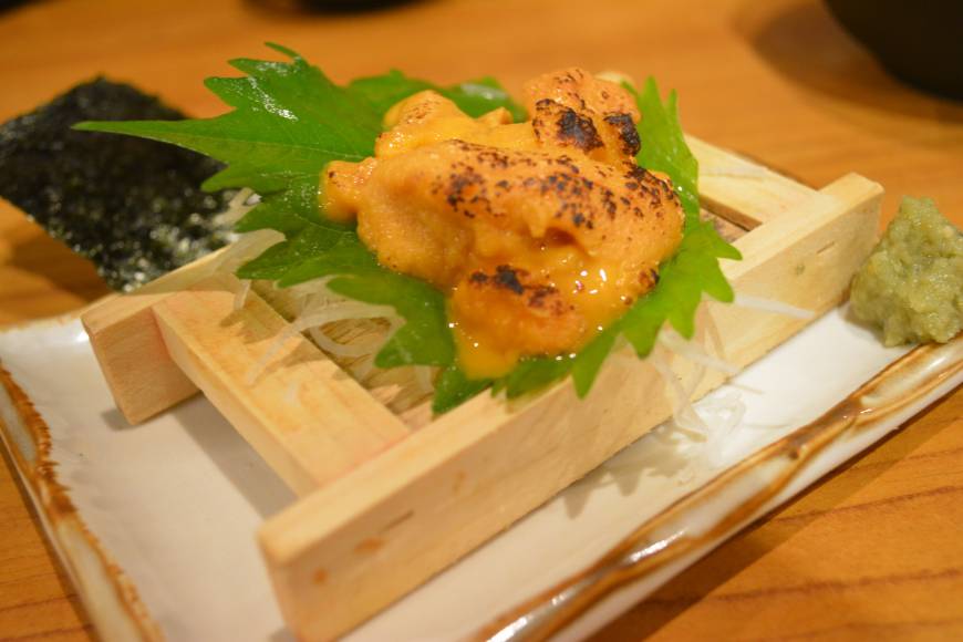 Tottuan On the house: An uni (sea urchin) dish came courtesy of the restaurant ahead of a 'mountain' of tempura when our critic visited Tottuan in Osaka. | J.J. O'DONOGHUE