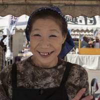 Here to stay: Mieko Matsuno sells seafood dishes at her market stall in Minamisanriku, Miyagi Prefecture. Once-stopgap market is much-loved symbol of recovery for Tohoku town