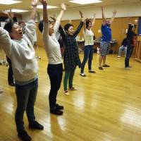 Uplifting: Gareth Hinchley (second from right), the writer/director of Tokyo Theatre for Children's Dick Whittington, joins other cast members in rehearsal. New 'Dick Whittington' pantomime spells fun for all the family