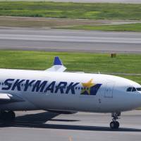 A Skymark Airlines Inc. aircraft taxies at Haneda airport in Tokyo in August. Struggling Skymark Airlines in code-sharing talks with both ANA and JAL