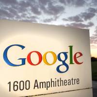 A jogger passes a Google Inc. sign at the firm’s headquarters in Mountain View, California, in October 2010. 'Right to be forgotten' on the Internet gains traction in Japan